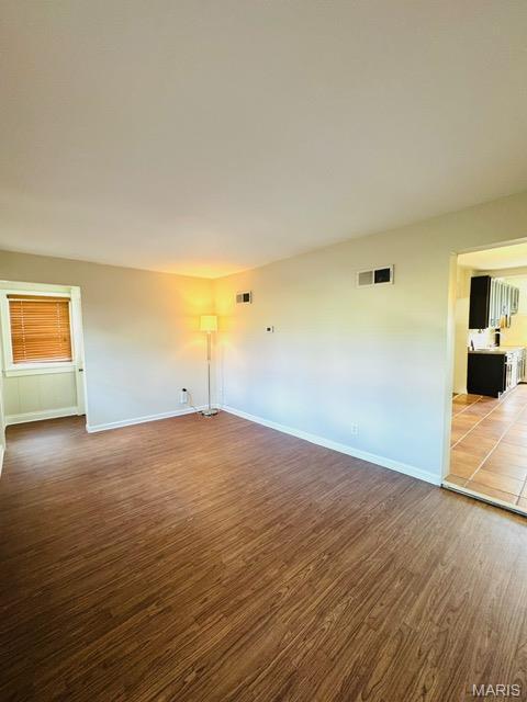 1928 Arsenal St, Saint Louis, MO 63118 - empty room featuring wood finished floors