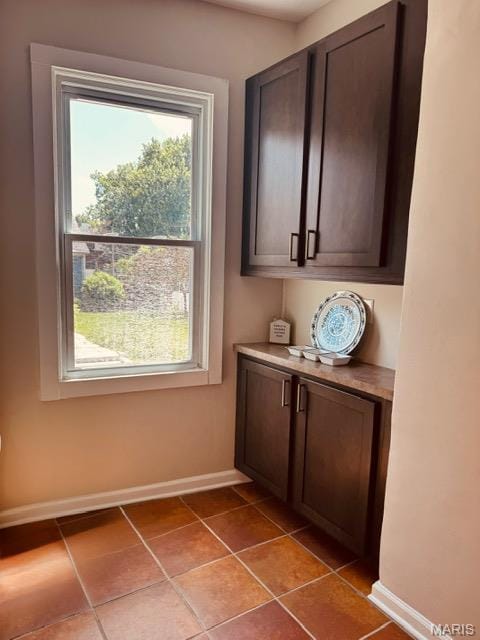 1928 Arsenal St, Saint Louis, MO 63118 - doorway featuring baseboards and light tile patterned floors