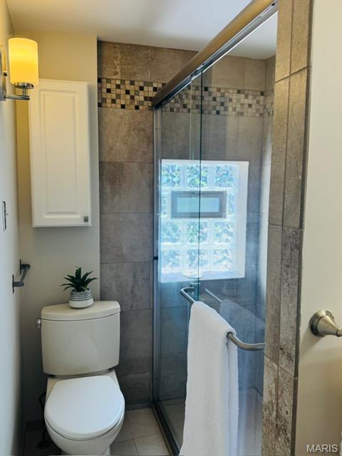 1928 Arsenal St, Saint Louis, MO 63118 - bathroom featuring a stall shower and tile patterned floors