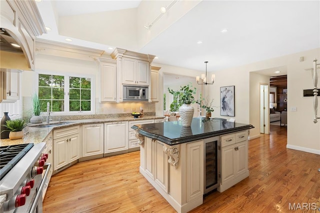 16427 Andraes Dr, Chesterfield, MO 63005 - kitchen featuring beverage cooler, stainless steel appliances, premium range hood, a chandelier, and light wood-style floors