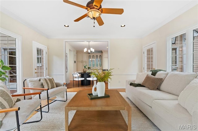 16427 Andraes Dr, Chesterfield, MO 63005 - living room with a chandelier, light wood-style flooring, ornamental molding, recessed lighting, and ceiling fan