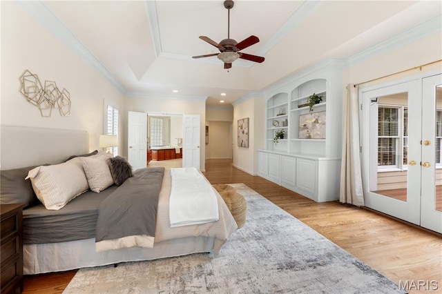 16427 Andraes Dr, Chesterfield, MO 63005 - bedroom featuring french doors, crown molding, light wood-style flooring, a raised ceiling, and recessed lighting