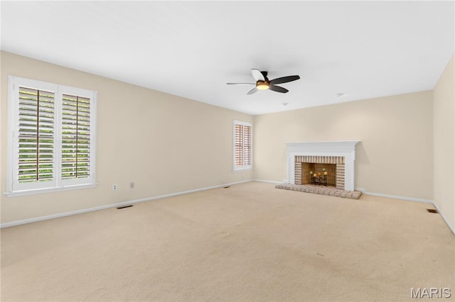 16427 Andraes Dr, Chesterfield, MO 63005 - unfurnished living room with a ceiling fan, a fireplace, and light carpet