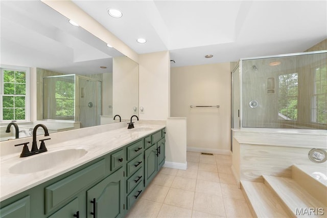 16427 Andraes Dr, Chesterfield, MO 63005 - bathroom with double vanity, a bath, tile patterned floors, a stall shower, and recessed lighting