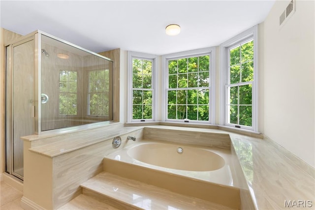 16427 Andraes Dr, Chesterfield, MO 63005 - full bathroom featuring a garden tub and a shower stall