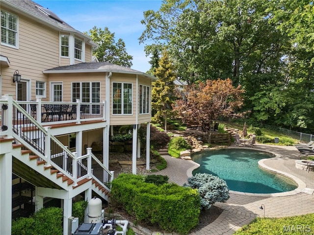 16427 Andraes Dr, Chesterfield, MO 63005 - swimming pool featuring stairway, a patio area, and a wooden deck