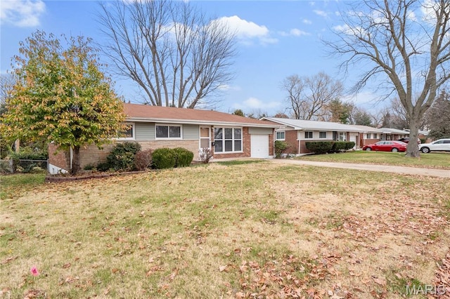 7 Flamingo Dr, Hazelwood, MO 63042 - ranch-style home with an attached garage, brick siding, and a front lawn