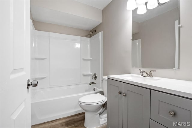 7 Flamingo Dr, Hazelwood, MO 63042 - bathroom with vanity,  shower combination, and wood finished floors