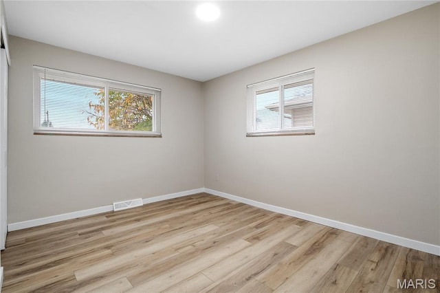 7 Flamingo Dr, Hazelwood, MO 63042 - unfurnished room featuring light wood-style flooring and baseboards