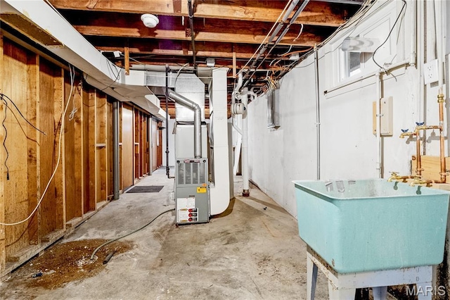 7 Flamingo Dr, Hazelwood, MO 63042 - unfinished below grade area with a sink and heating unit