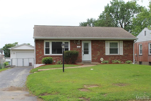 9240 Wabaday Ave, Overland, MO 63114 - view of front of home featuring an outdoor structure, a detached garage, brick siding, roof with shingles, and a gate