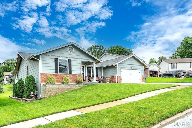 713 Settler Rd, Fenton, MO 63026 - view of front of home featuring brick siding, a front yard, an attached garage, and concrete driveway