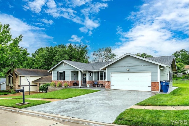 713 Settler Rd, Fenton, MO 63026 - ranch-style home featuring brick siding, an attached garage, concrete driveway, and a front lawn