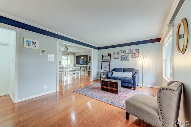 713 Settler Rd, Fenton, MO 63026 - living area with crown molding, wood finished floors, and a ceiling fan