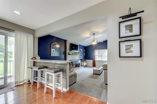 713 Settler Rd, Fenton, MO 63026 - living room with wood finished floors, a ceiling fan, and vaulted ceiling
