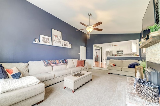 713 Settler Rd, Fenton, MO 63026 - living room with ceiling fan, light colored carpet, lofted ceiling, and a brick fireplace