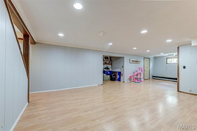 713 Settler Rd, Fenton, MO 63026 - basement featuring a baseboard heating unit, ornamental molding, light wood-style floors, and recessed lighting