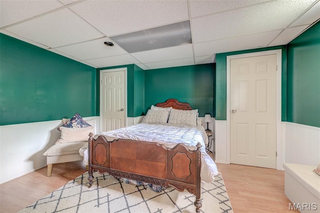 713 Settler Rd, Fenton, MO 63026 - bedroom with a paneled ceiling, wood finished floors, and wainscoting