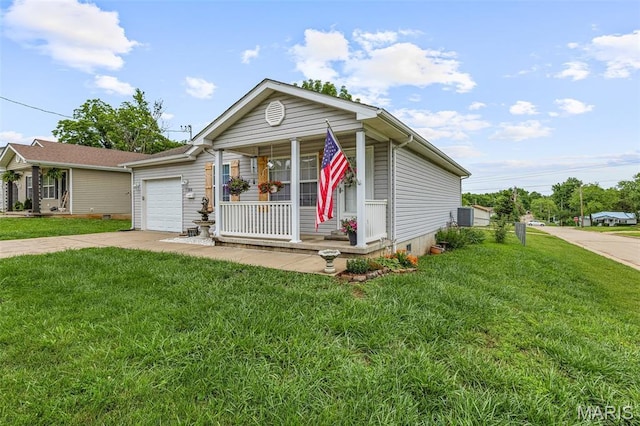 310 S Harry Junior St, Desloge, MO 63601 - single story home featuring covered porch, driveway, a garage, a front yard, and crawl space