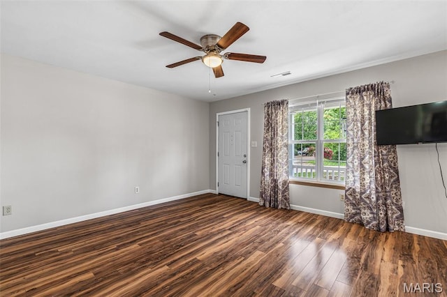 310 S Harry Junior St, Desloge, MO 63601 - empty room with wood finished floors, baseboards, and a ceiling fan