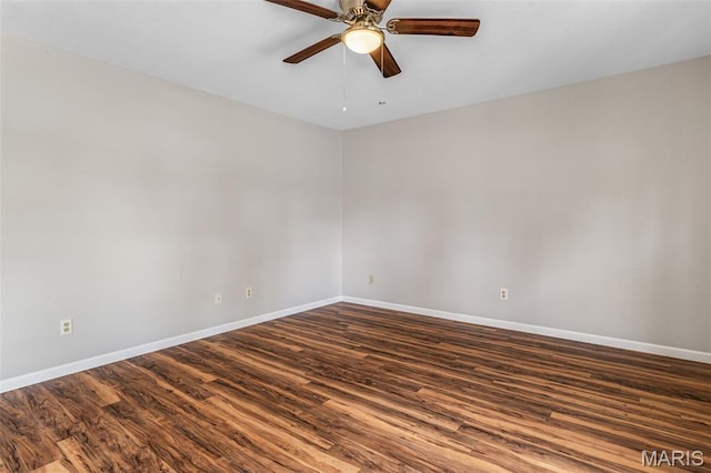 310 S Harry Junior St, Desloge, MO 63601 - empty room with ceiling fan, dark wood-style flooring, and baseboards