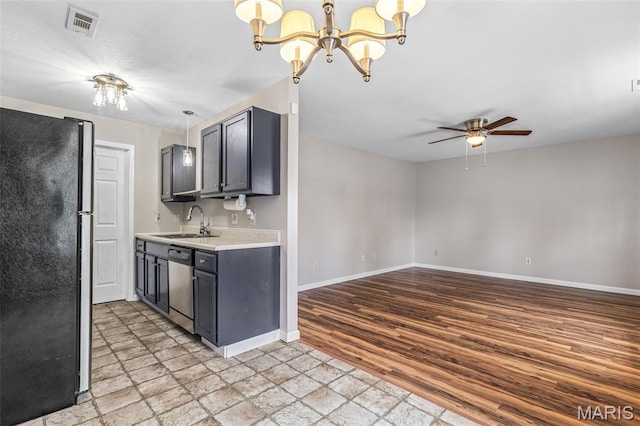 310 S Harry Junior St, Desloge, MO 63601 - kitchen featuring freestanding refrigerator, stainless steel dishwasher, a sink, light countertops, and ceiling fan