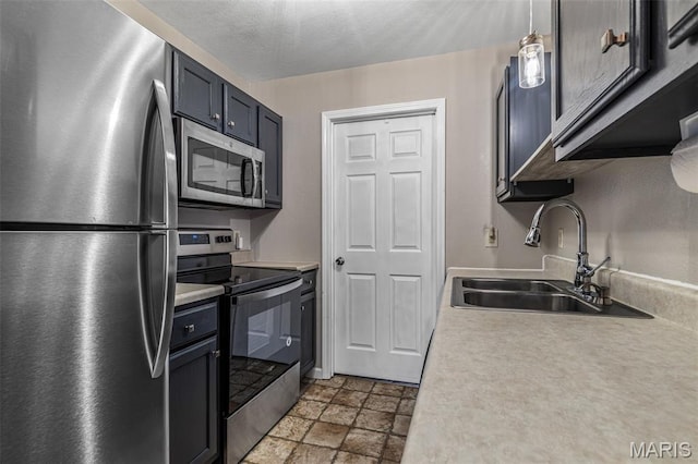 310 S Harry Junior St, Desloge, MO 63601 - kitchen with stainless steel appliances, a sink, stone finish floors, and light countertops