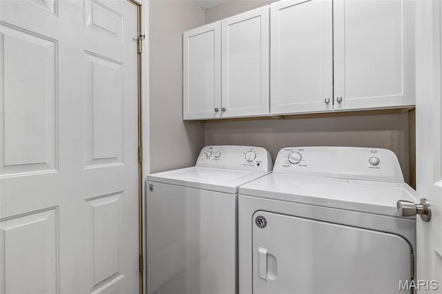 310 S Harry Junior St, Desloge, MO 63601 - laundry room featuring washing machine and clothes dryer and cabinet space