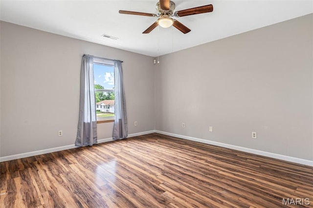 310 S Harry Junior St, Desloge, MO 63601 - empty room with wood finished floors, ceiling fan, and baseboards