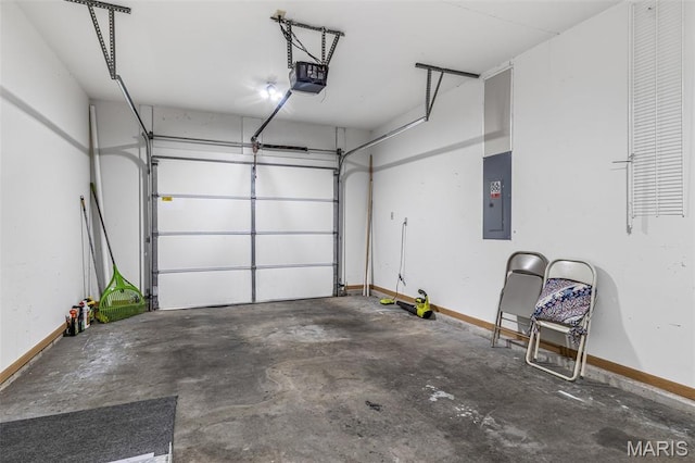 310 S Harry Junior St, Desloge, MO 63601 - garage featuring electric panel, a garage door opener, and baseboards