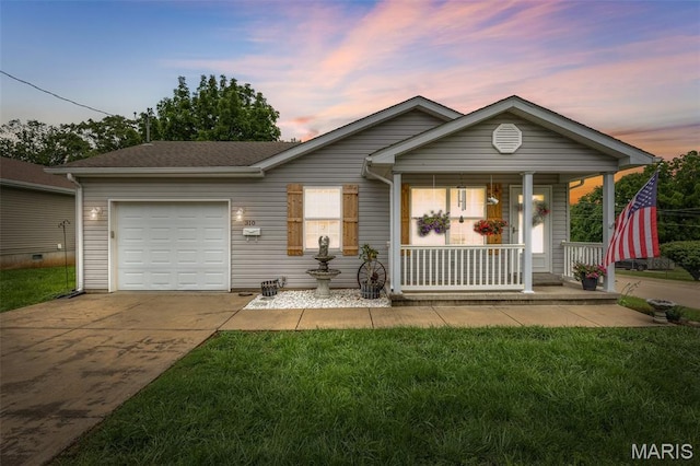 310 S Harry Junior St, Desloge, MO 63601 - single story home featuring an attached garage, a porch, concrete driveway, and a yard
