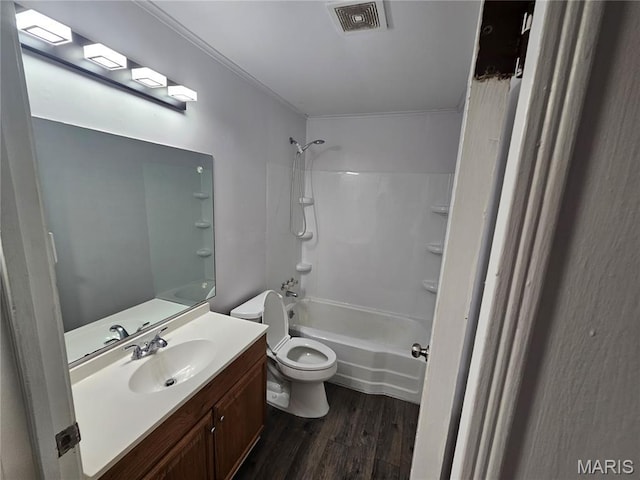 1150 Lilac Dr, Belleville, IL 62220 - bathroom featuring toilet, vanity, shower / washtub combination, and wood finished floors