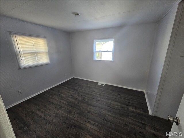 1150 Lilac Dr, Belleville, IL 62220 - unfurnished room featuring dark wood finished floors and baseboards