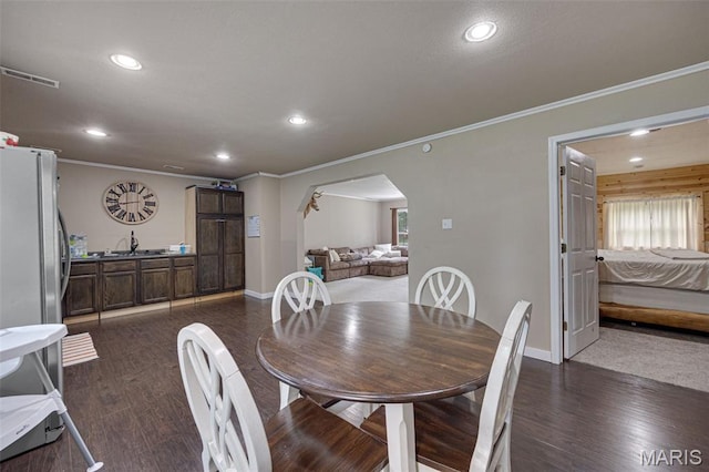 14864 S State Highway 21, Potosi, MO 63664 - dining room with arched walkways, recessed lighting, crown molding, dark wood-style flooring, and baseboards