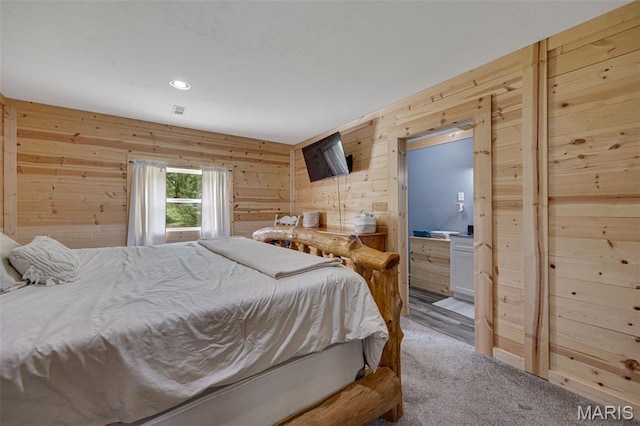 14864 S State Highway 21, Potosi, MO 63664 - carpeted bedroom with wood walls, recessed lighting, and ensuite bathroom