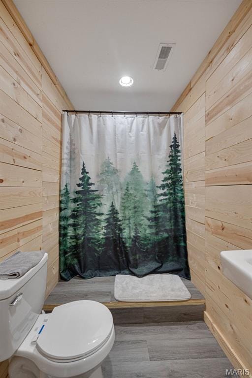 14864 S State Highway 21, Potosi, MO 63664 - full bathroom with wood walls, toilet, and a shower with curtain