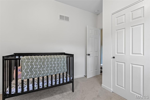 carpeted bedroom featuring baseboards