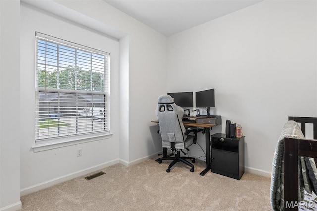 office with plenty of natural light, carpet flooring, and baseboards