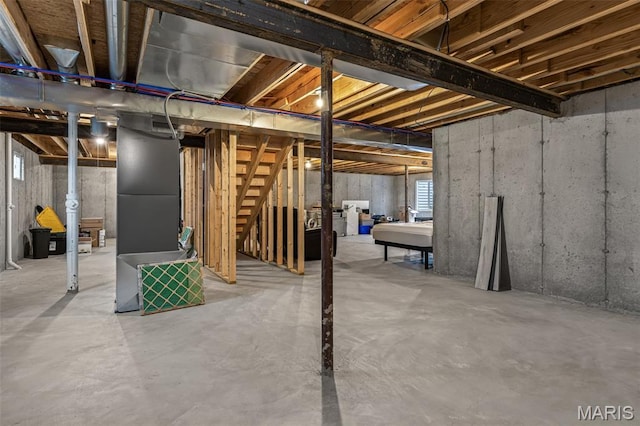 basement featuring stairs