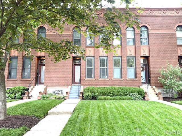 4333 Laclede Ave Unit D, Saint Louis, MO 63108 - view of front of property featuring a front yard, entry steps, and brick siding