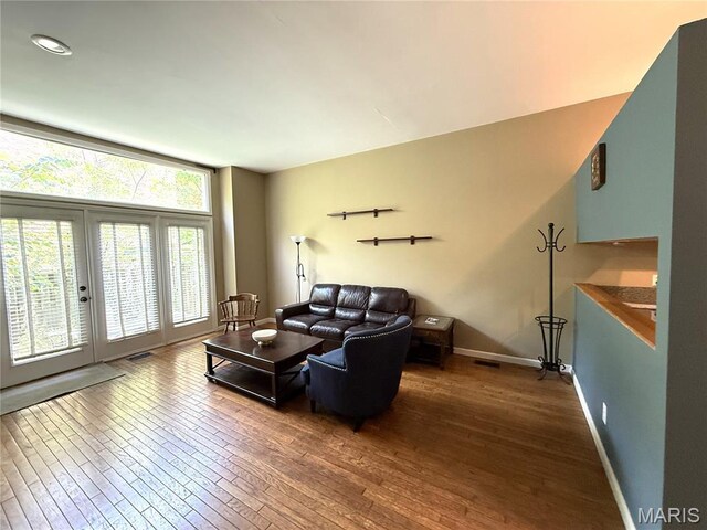 4333 Laclede Ave Unit D, Saint Louis, MO 63108 - living area with dark wood-type flooring and baseboards