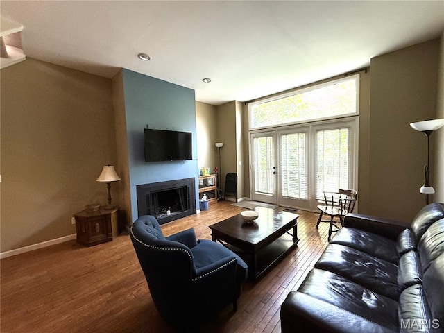 4333 Laclede Ave Unit D, Saint Louis, MO 63108 - living area with wood-type flooring, a fireplace, baseboards, and recessed lighting