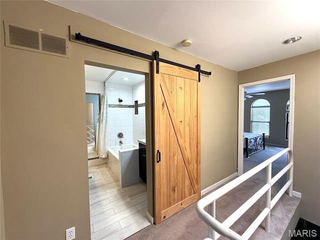 4333 Laclede Ave Unit D, Saint Louis, MO 63108 - hall featuring a barn door