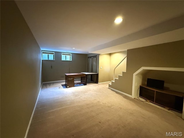 4333 Laclede Ave Unit D, Saint Louis, MO 63108 - basement featuring baseboards, carpet floors, stairway, and recessed lighting