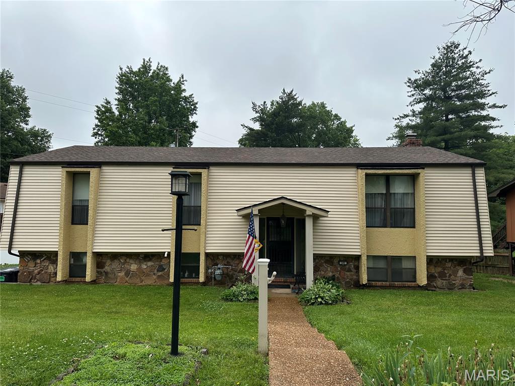305 Berkshire Dr, Belleville, IL 62223 - view of front of house featuring a front lawn, a chimney, and stone siding