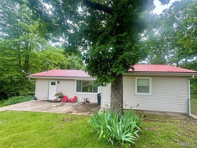 19040 State Route Ee, St James, MO 65559 - back of property with a yard, a patio area, and a metal roof