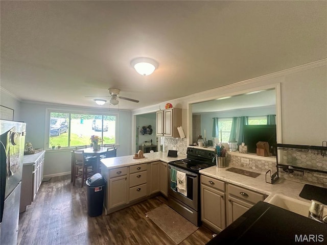19040 State Route Ee, St James, MO 65559 - kitchen with stainless steel electric range, dark wood-style flooring, ornamental molding, light countertops, and backsplash