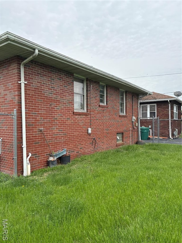 717 N 40th St E, St Louis, IL 62205 - view of home's exterior with brick siding