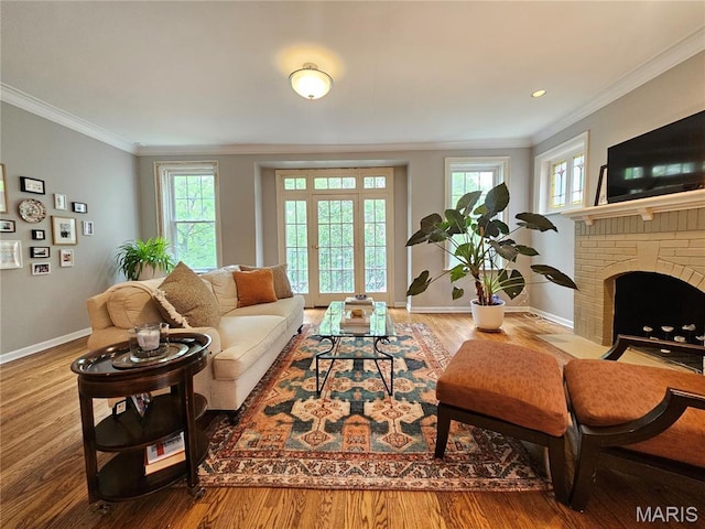 6240 Rosebury Ave Unit 2E, Saint Louis, MO 63105 - living area featuring ornamental molding, wood finished floors, and a fireplace