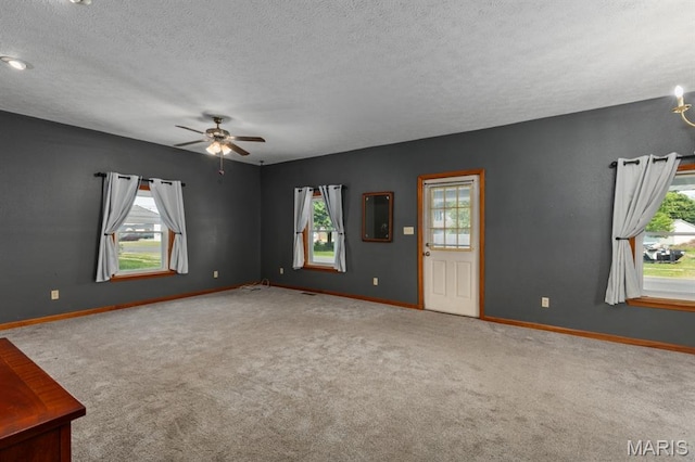 311 S Edwardsville St, Staunton, IL 62088 - carpeted spare room with ceiling fan and a textured ceiling